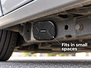 Compact petZeye GPS 905 tracker mounted beneath a car on a metal chassis surface