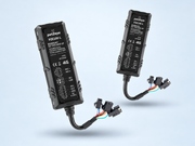 Two petZeye PZE100-L wired GPS trackers shown with their cables and connectors