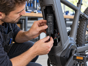 petZeye PZE100-L wired GPS tracker being installed inside an electric bicycle frame